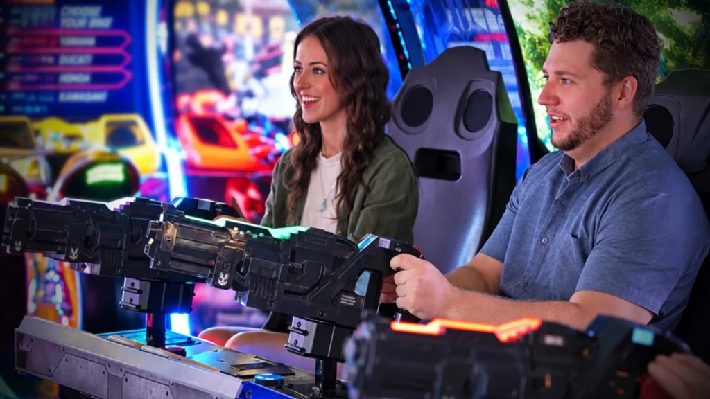 Guests playing modern arcade games together